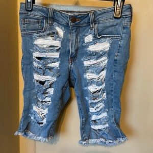 Ripped mid length shorts